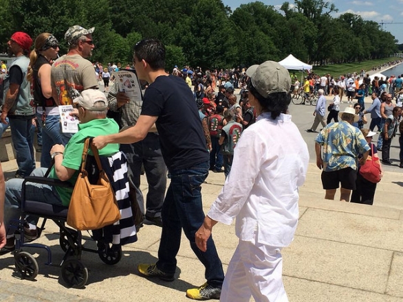 A member of Messiah Foundation USA hands out leaflets at the National Mall in Washington DC