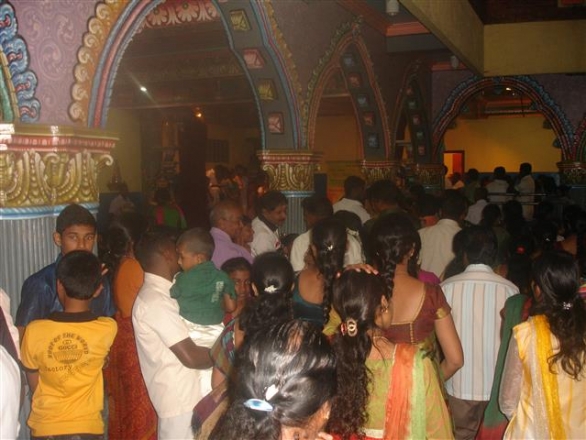 Attendees wait to receive Invocation of the Heart (Simran) of Ra Raam from Kalki Avatar Foundation presenters (Kathiresan Temple