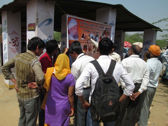 People gathered at our stall outside Shani Dev Maharaj Temple in Kosi Kalan, Haryana, India.